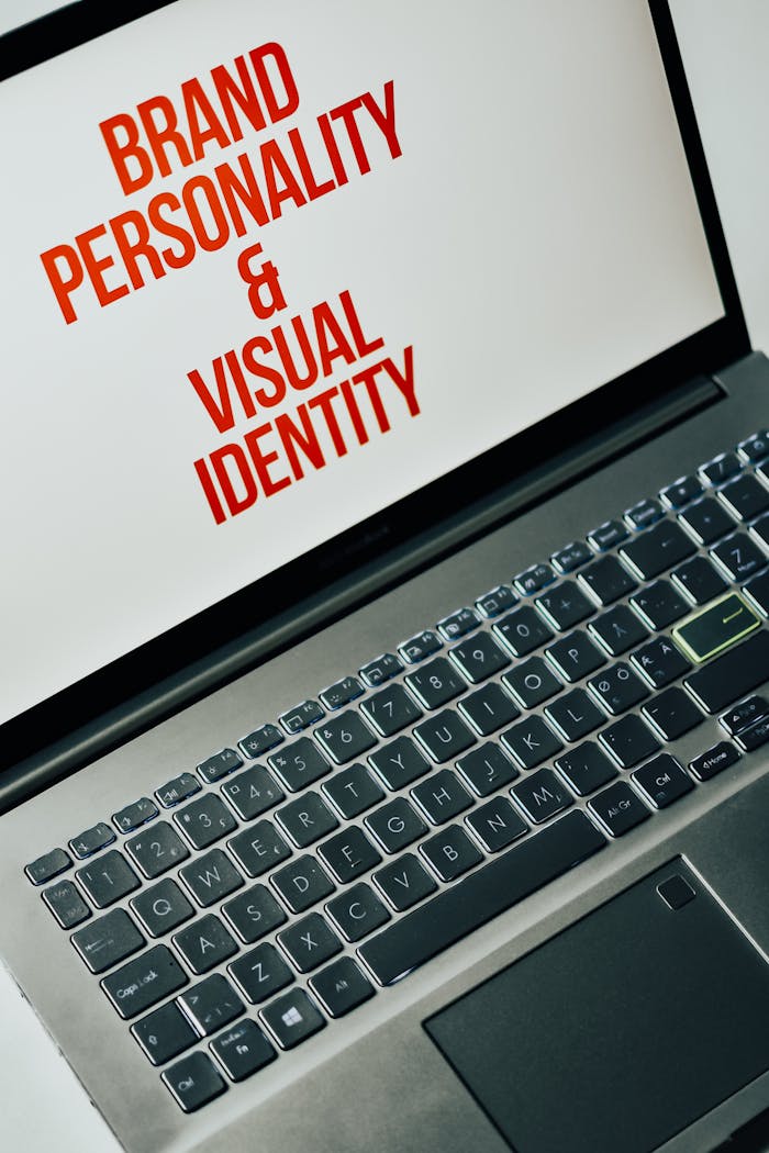 hero-img-02 Laptop screen showing text on brand personality and visual identity for marketing strategy.